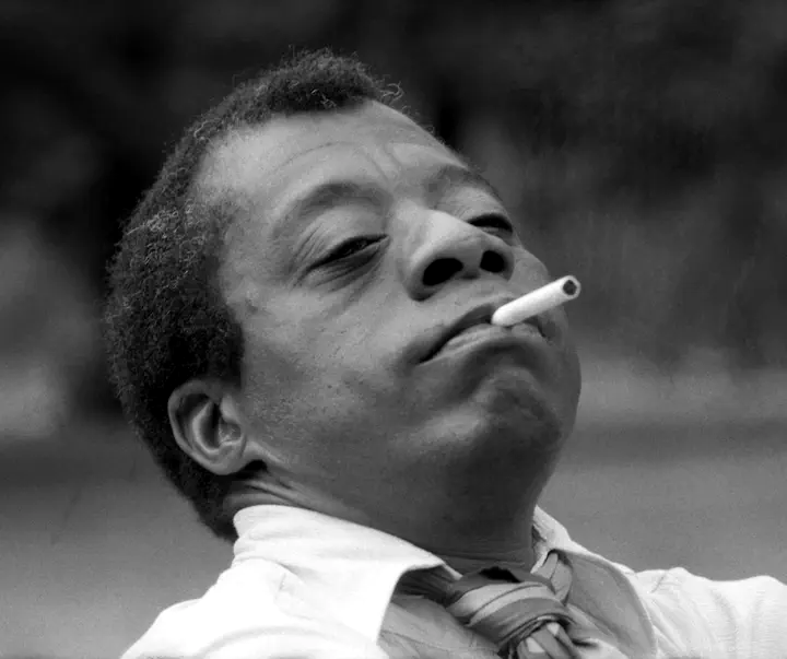 James Baldwin smoking a cigarette